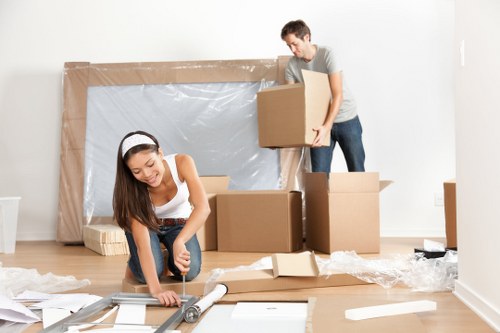 Furniture pick-up team handling bulky items in a Shoreditch flat