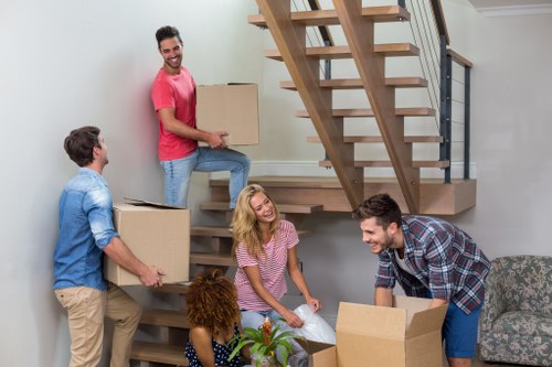Team preparing a safe moving job with boxes and equipment
