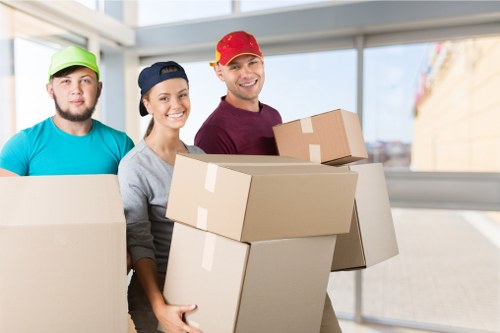 Professional movers planning removals in Shoreditch near modern apartments