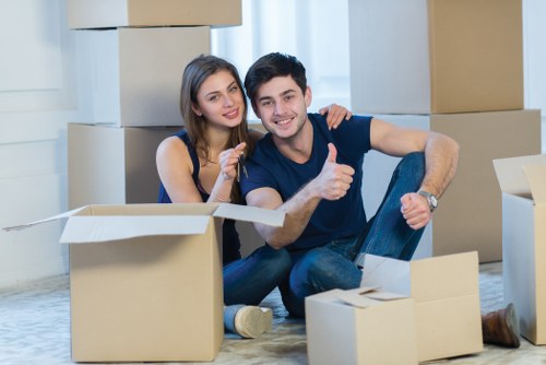 Professional movers packing and loading boxes for a Shoreditch home removal