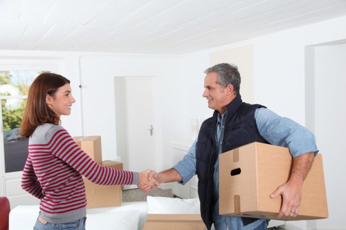 Packaged household items being handled with care during loading
