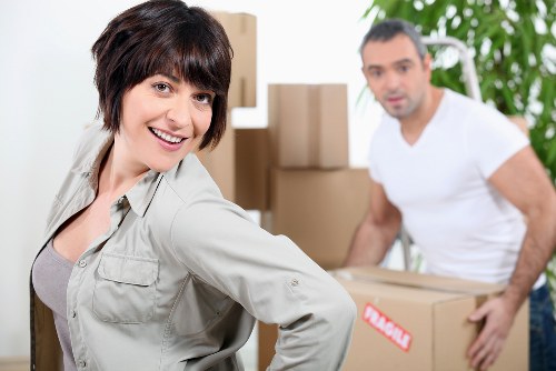 Professional movers navigating a Shoreditch apartment staircase for a same day move