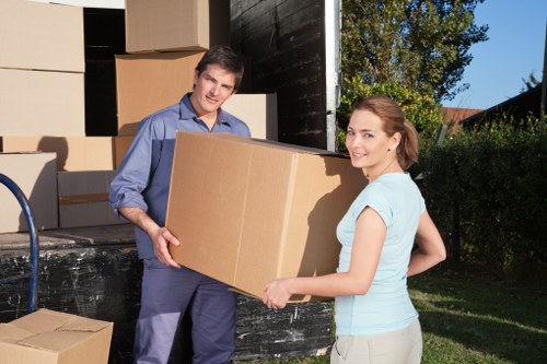 Furniture being carried down stairs during a Shoreditch flat move
